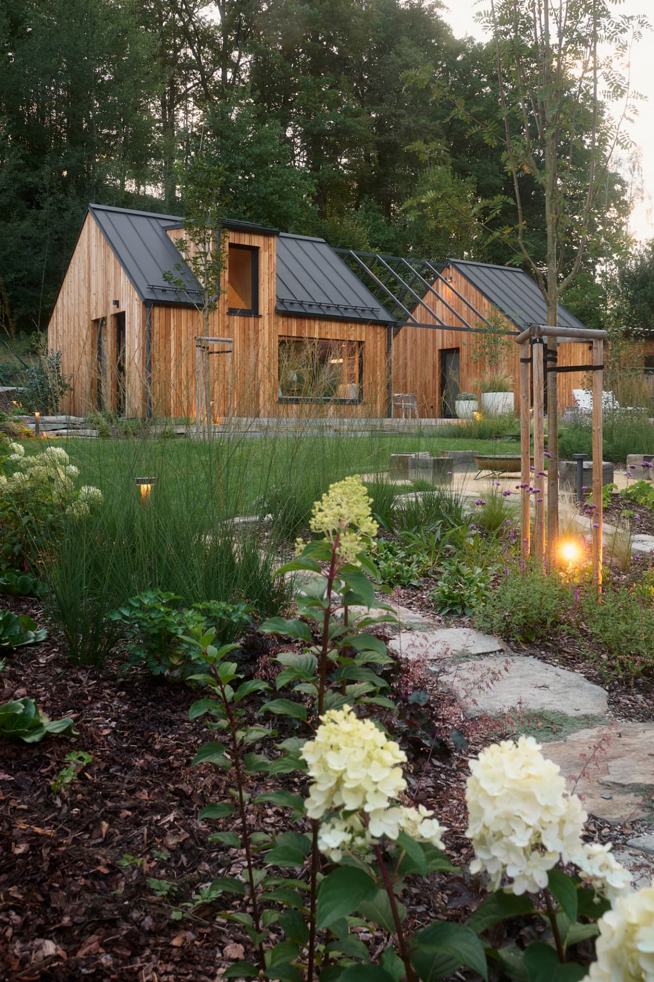 The HYGGE garden and timber buildings in the morning