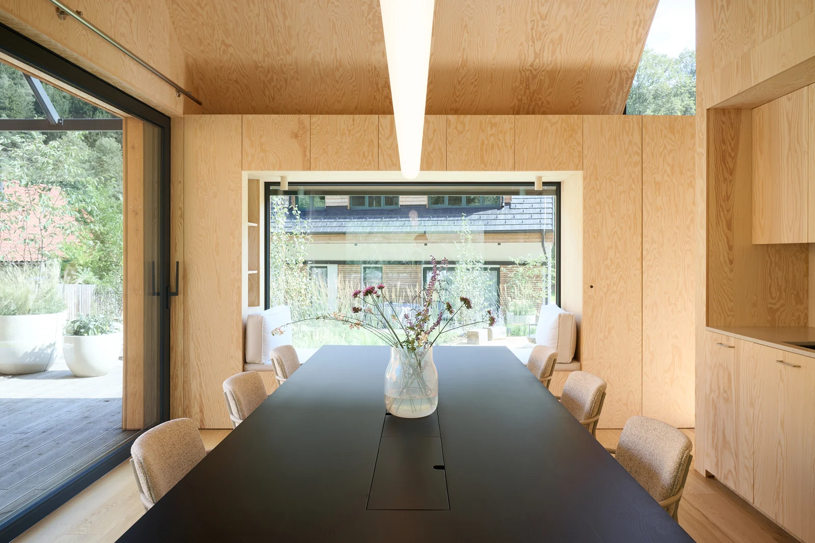 Inside the Meetinghouse: the long table set with wildflowers