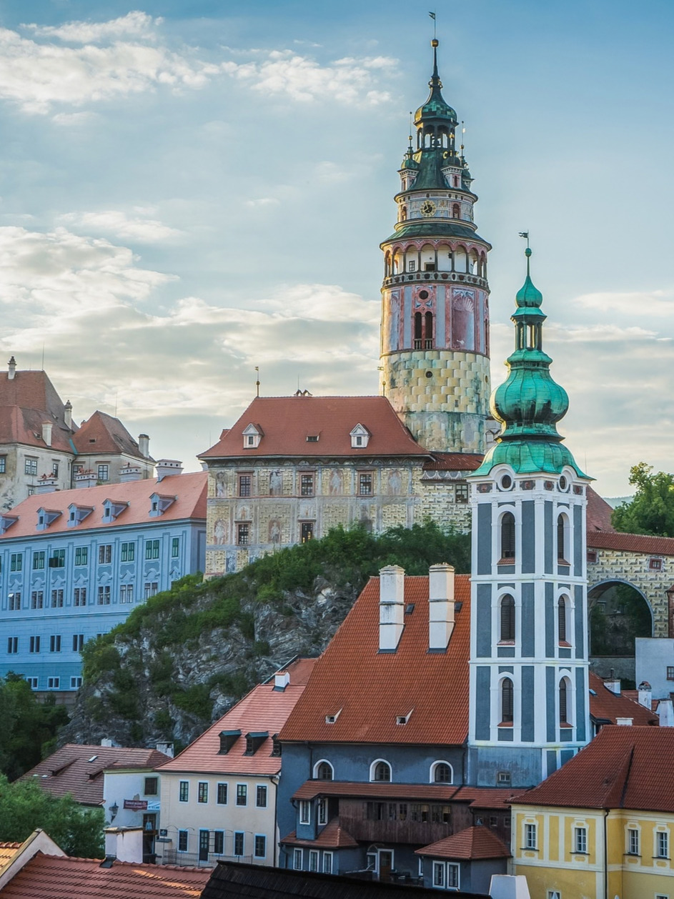 Český Krumlov castle tower and church rising above the town rooftops