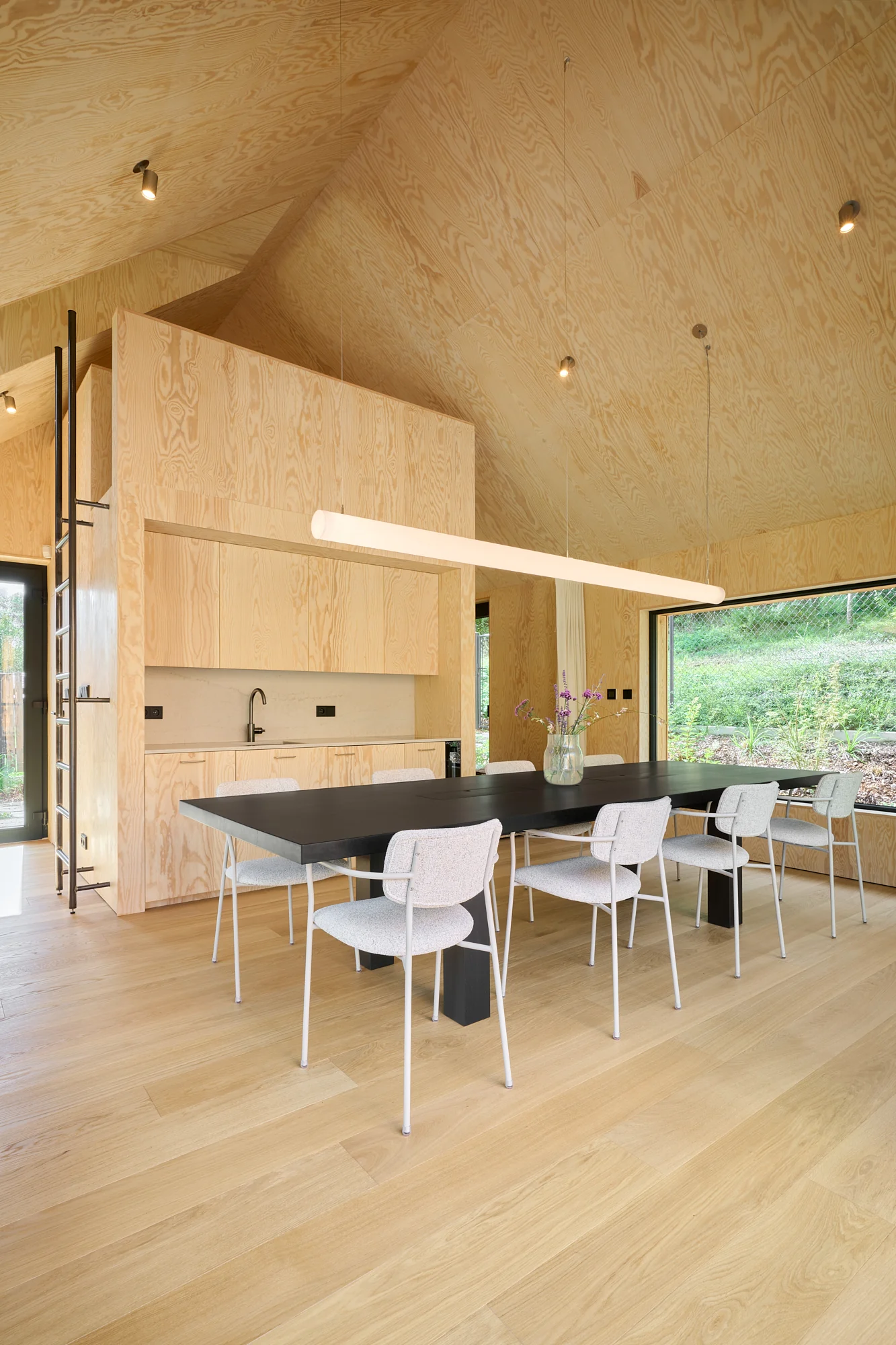 Inside the Meetinghouse: a long black table and kitchen counter